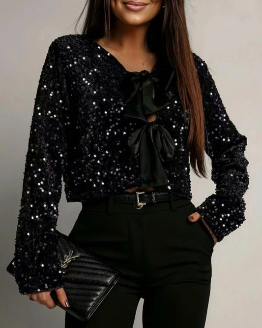 Paljettopp med rosett Svart