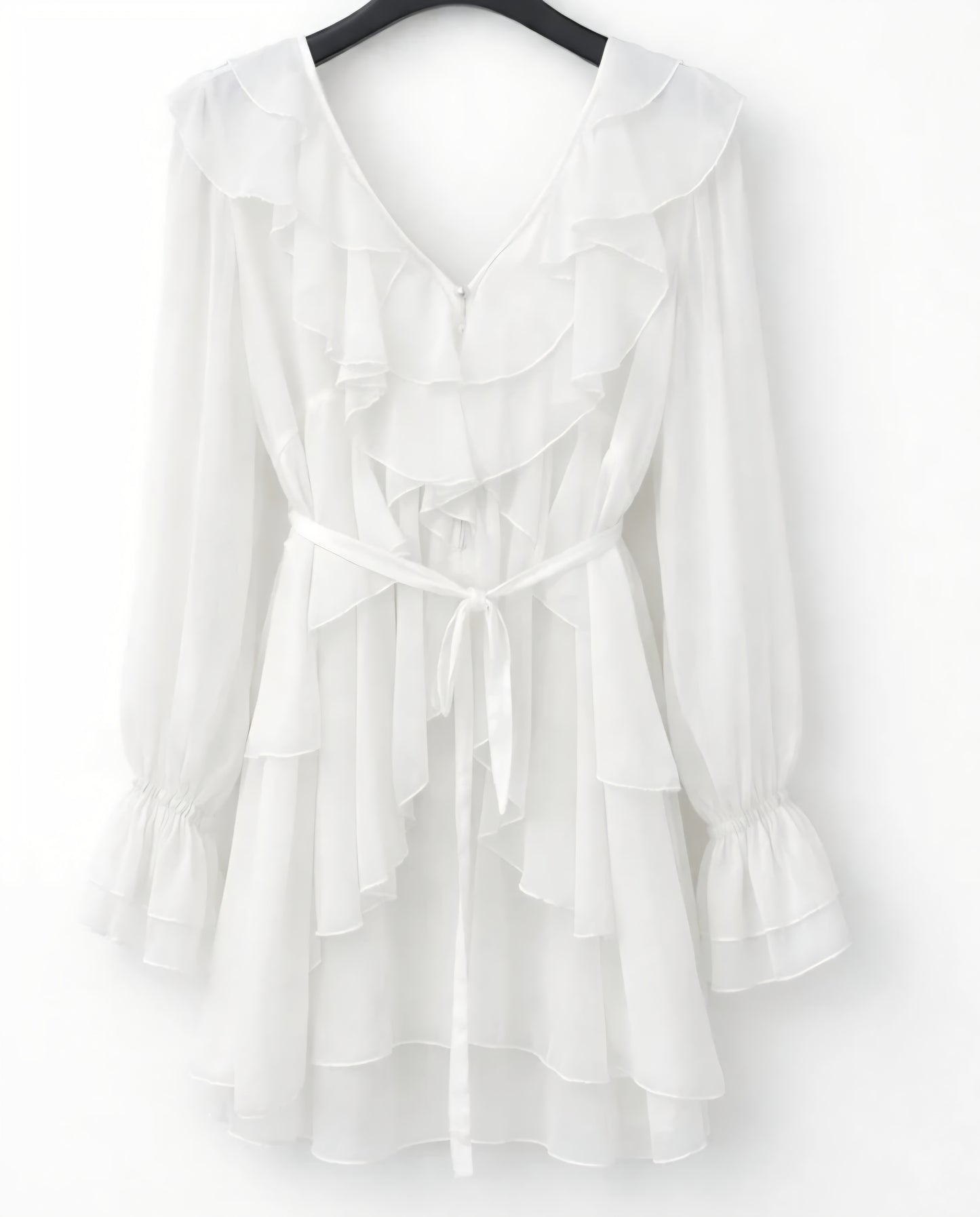 Böljande klänning med volanger Vit