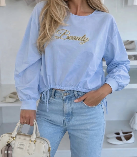 SKÖNHET guldfärgad bomullsblus Blå