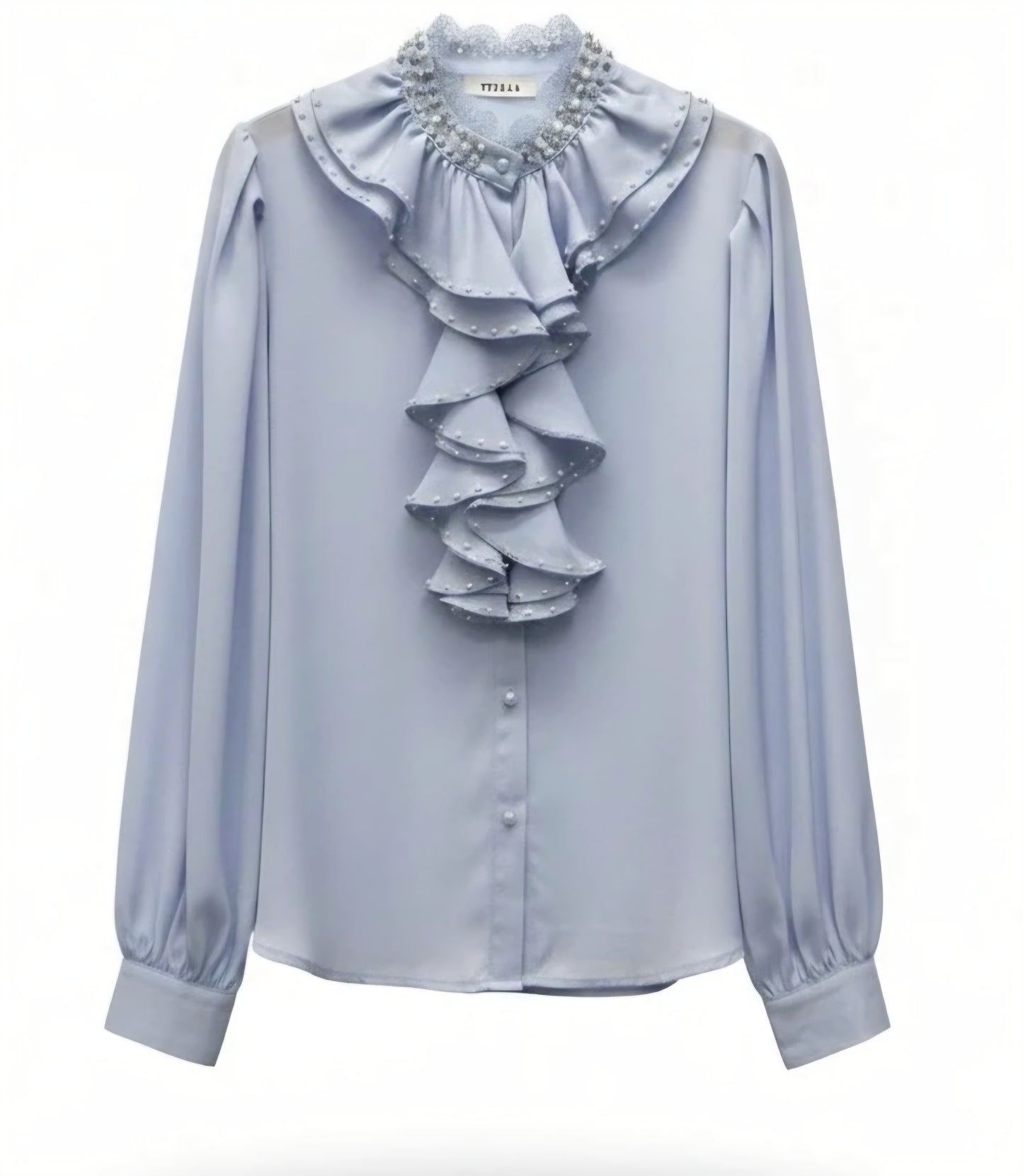 Satinblus med lager på lager av volanger Ljusblå