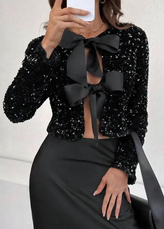 Paljettopp med rosett Svart