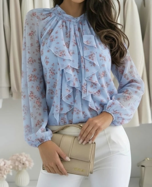 Blus med volangkrage och blommigt tryck Blå