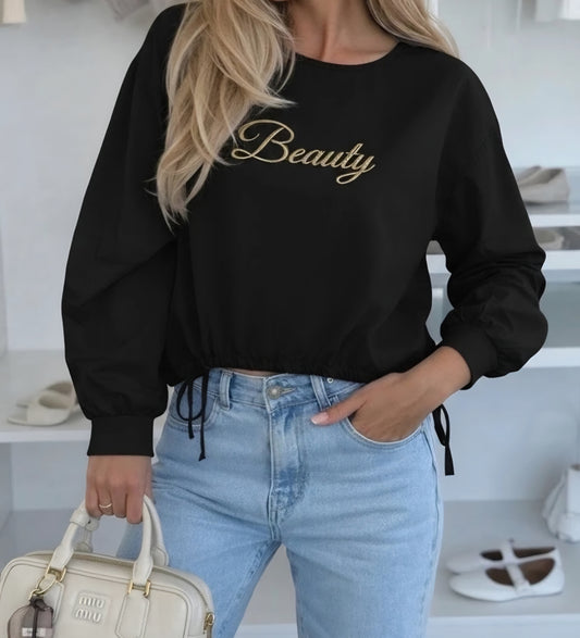 SKÖNHET guldfärgad bomullsblus Svart