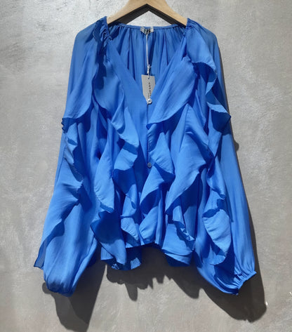 Långärmad blus med volang i lyocell blå